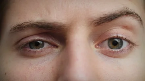 Close up of Man's face raising eyebrow. Boy with blue eyes looking at camera. Stock Footage 142908149