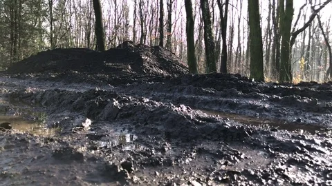 Close-up of man's feet running in the mud. Stock Footage 82681663