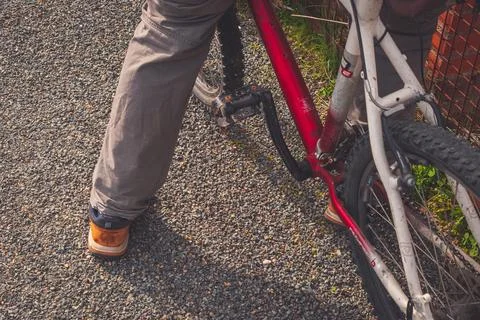 A close-up of man's feet while on bicycle Stock Photos