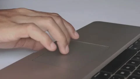 Close-up of man's Finger using laptop trackpad scrolling Video stock 291856186