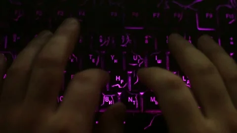 Close-up of a man's fingers typing on a keyboard 库存影片 333707030