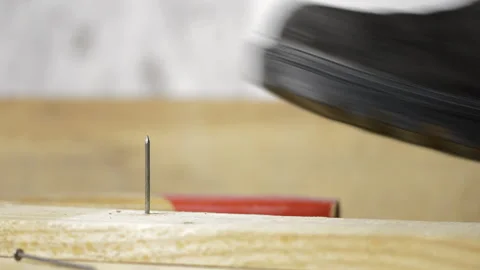 Close-up of man's foot stepping over there nail inserted in wooden plank. Stock-Footage 188383025