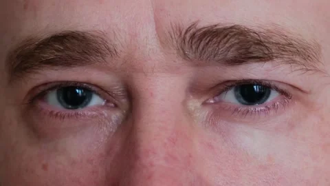 Close-up of a man's gray eyes with dilated big pupils. Stock-Footage 275811021