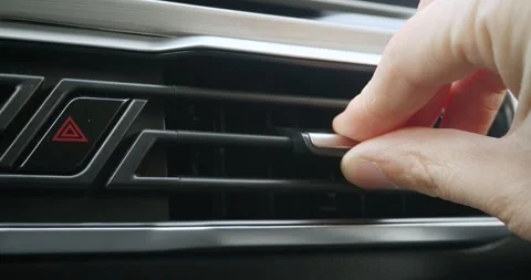 Close-up of a man's hand adjusting the ventilation inside the car. Stock-Footage 261748894