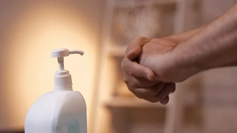 Close-up of a man's hand and hand sanitizer. Stock Footage 132076625