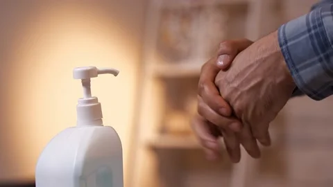Close-up of a man's hand and hand sanitizer. Stock Footage 132076815