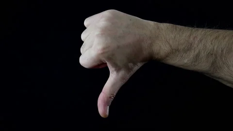 Close up, man's hand on black background making the thumbs down sign Stock Footage 144206371