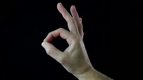 Close-up, man's hand on black background while making the ok sign Stock Footage 144208477