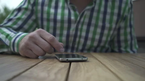 Close up of man's hand browsing smartphone. Stock Footage 52689696