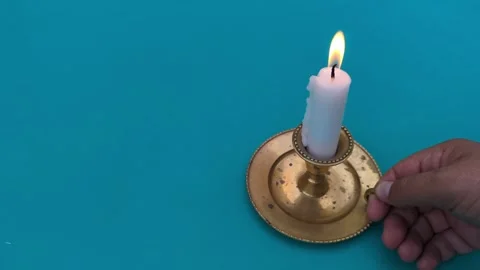 Close up of a man's hand with a candle on a table with green screen Vídeos de archivo 342845498