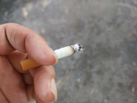 Close up of mans hand with cigarette. Stock Photos