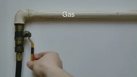 Close-up of mans hand close and open gas pipe valve 動画素材 102027218