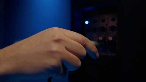 Close-up of a man's hand that connects a speaker with a cable Stock Footage 194438464