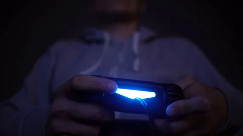 Close-up man's hand with controller, game pad. Man play at night 스톡 동영상 73742579