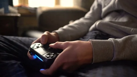 Close-up man's hand with controller, game pad Stock Footage 73750411