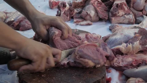 Close up of a man's hand cutting meat with a knife Stock Footage 311579977