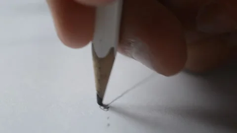 Close-up man's hand draw with a pencil crayon on a white paper. pencil graphic Stock Footage 198861883