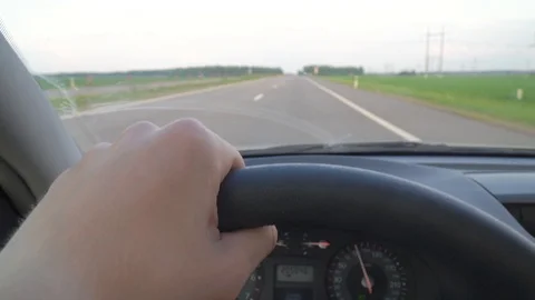 Close-up man's hand driving car Stock Footage 116562631