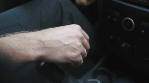 Close-up of a man's hand on the gear lever of a car Stock Footage 236245463