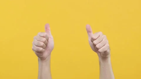 Close up of Man’s hand gestures. Approval like. Man showing thumb up isolated on Stock Footage 144668528