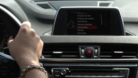 Close-up of a man's hand gripping the steering wheel of his car and making Stock-Footage 155824904