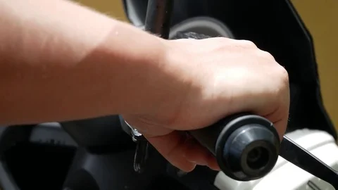 Close-up of man's hand on handlebars of motorcycle. Stock Footage 82530324