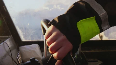 Close-up of a man's hand at the helm of a helicopter 스톡 동영상 188757055