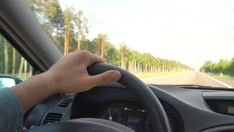 Close - up man's hand holding steering wheel car Stock Footage 116492998