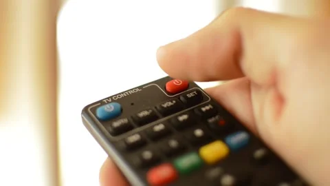 Close-up man's hand holding tv remote and turn on the television. Stock Footage 218594314