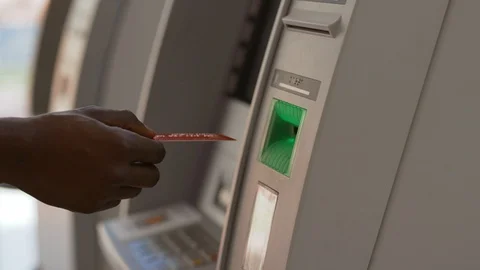 Close-up of man's hand inserting a credti card to withdraw money from bank 스톡 동영상 110460730
