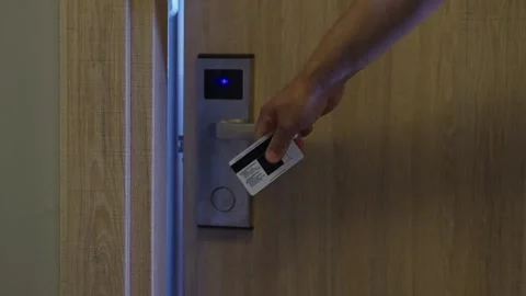 Close-up. A man's hand with a key card. A man opens the electronic lock of a Stock Footage 291637850