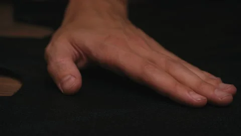 Close up man's hand move slowly on black fabric in workshop. Workshop hipsters Stock-Footage 138259109
