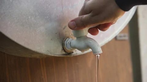 Close-Up Man's Hand  Open and closes The Tap With Water Stock Footage 257624915