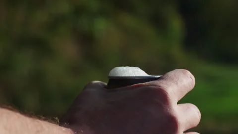 Close-up of a mans hand opening a can of beer with fresh white foam overflo.. Stock Footage 346720468