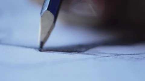 Close-up man's hand with pencil drawing art on paper Stock Footage 203716716