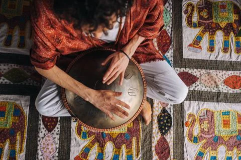 Close-up of a man's hand playing a modern musical instrument, the orion reed  Stock Photos