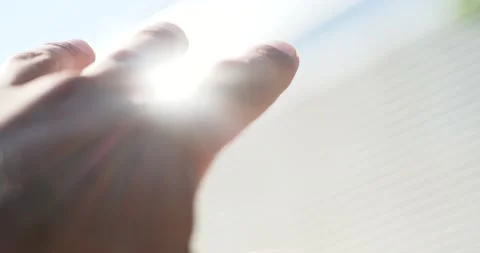 Close Up of Man`s Hand is playing with Sun Rayses, Sun touching his Hand Video stock 139053626