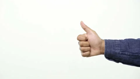 Close up of man’s hand pointing to the left side showing thumb up sign isolated  Stock Footage 144653845