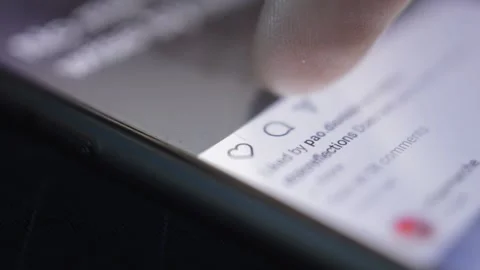 Close-up man's hand like post on instagram social media on the iphone. Video stock 231760360