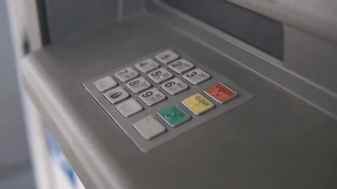 Close up of a man's hand presses a button and enters a PIN code into an ATM Stock Footage 129558032