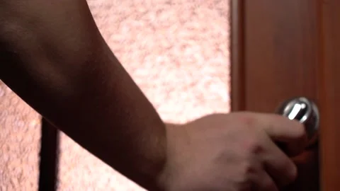 Close-up of a Man's Hand Pushes the Handle and Opens the Door to the Light Room Stock Footage 147383841