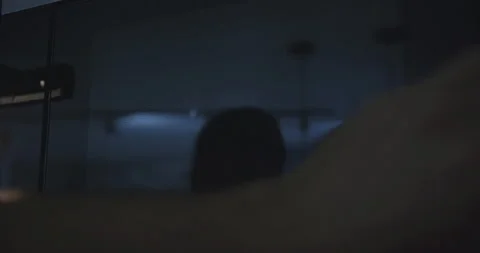 Close-up of a man's hand putting a white plate out of the microwave. Stock Footage 252613566