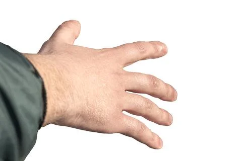 Close-up of a man's hand reaching for something that looks like a bottle or a Foto stock