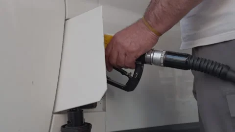 Close-up of Man's Hand Refueling Car with Fuel Nozzle at Gas Station Video stock 315899641