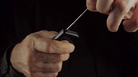 Close-up of a man's hand with a remote control with an antenna Stock Footage 169284994