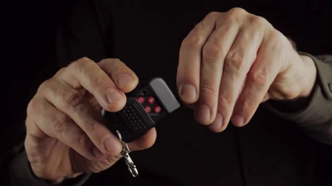 Close-up of a man's hand with a remote control with an antenna Stock Footage 169410894