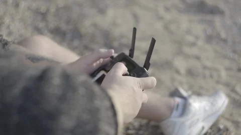 Close up man's hand with remote controller drone. Stock Footage 113632383