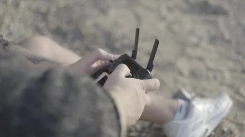 Close up man's hand with remote controller drone. Stock Footage 113632424