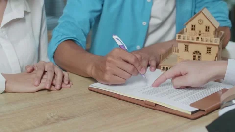 Close Up Of Man'S Hand Signing On House Purchase Contract Paper While 库存影片 200823306