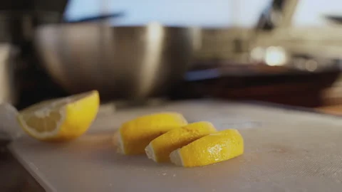 Close-up of a man's hand slicing a lemon 스톡 동영상 188767686